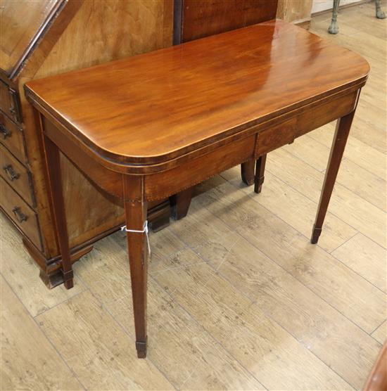 A George III inlaid mahogany folding card table W.91cm